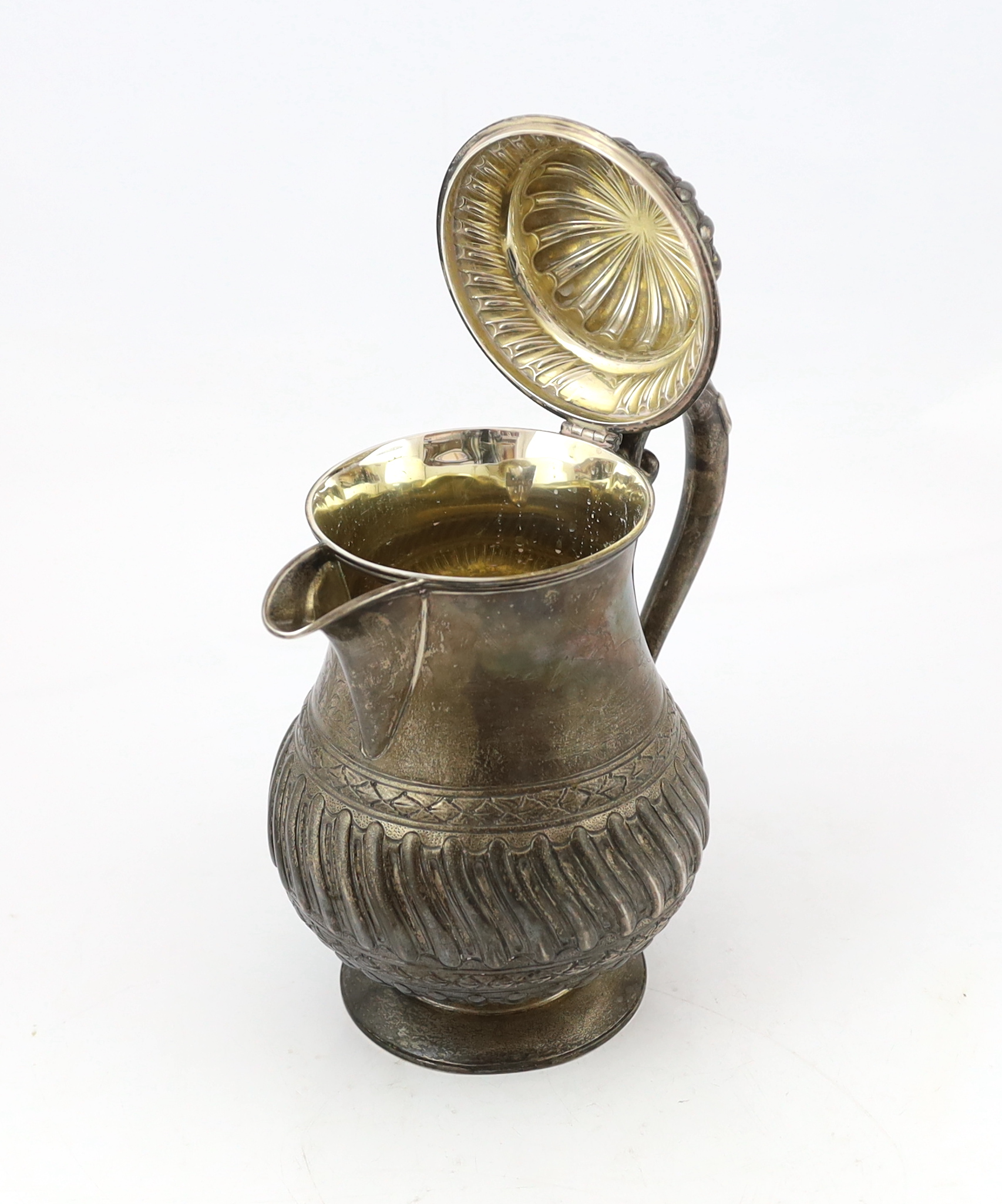 A late Victorian demi fluted wrythened silver water jug, by Mappin & Webb